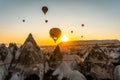 Beautiful aerial view of colorful hot air balloons flying over Cappadocia, Turkey. Royalty Free Stock Photo