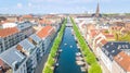 Beautiful aerial view of Copenhagen skyline from above, Nyhavn historical pier port and canal with color buildings and boats Royalty Free Stock Photo