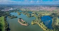 Beautiful aerial view of the Dinton Pastures Country Park, Black and White Swan Lake, and Winnersh Triangle Royalty Free Stock Photo