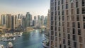 Beautiful aerial view of Dubai Marina promenade and canal with floating yachts and boats before sunset in Dubai, UAE. Royalty Free Stock Photo