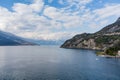 Beautiful aerial view of the famous Como Lake on sunny summer day. Clouds reflecting in calm waters of the lake with Alp mountains Royalty Free Stock Photo