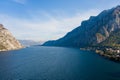 Beautiful aerial view of the famous Como Lake on sunny summer day. Clouds reflecting in calm waters of the lake with Alp mountains Royalty Free Stock Photo