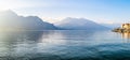 Beautiful aerial view of the famous Como Lake on sunny summer day. Clouds reflecting in calm waters of the lake with Alp mountains Royalty Free Stock Photo