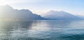 Beautiful aerial view of the famous Como Lake on sunny summer day. Clouds reflecting in calm waters of the lake with Alp mountains Royalty Free Stock Photo