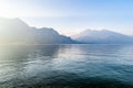 Beautiful aerial view of the famous Como Lake on sunny summer day. Clouds reflecting in calm waters of the lake with Alp mountains Royalty Free Stock Photo