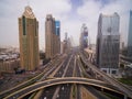 Beautiful aerial view of futuristic city landscape with roads, cars, trains, skyscrapers. Dubai, UAE