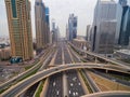 Beautiful aerial view of futuristic city landscape with roads, cars, trains, skyscrapers. Dubai, UAE