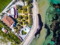 Beautiful aerial view of the house with its garden and a pool next to the coastline Royalty Free Stock Photo