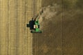 Beautiful aerial view of modern combine harvester working in field. Agriculture industry