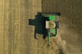 Beautiful aerial view of modern combine harvester working in field. Agriculture industry
