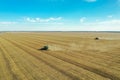 Beautiful aerial view of modern combine harvester working in field on sunny day. Agriculture industry