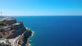 Beautiful aerial view over endless Atlantic Ocean surface and Gran Canaria Island landscape with highway and multiplicity hotels.