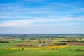 Beautiful aerial view at a patchwork landscape with farms and fields Royalty Free Stock Photo