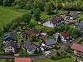 Aerial view of of residential area with houses in rural village Honau, Lichtenstein, Swabian Alb, in late spring.