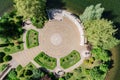 Aerial view of small island with trees, colonnade and multicolored floor mosaic