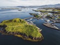 Aerial view of Stykkisholmur, small fishing town with harbour and boats on the sea in Iceland