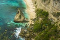 Beautiful aerial view of tropical paradise beach and rock cliff with amazing turquoise sea water and palm trees in Summer holidays Royalty Free Stock Photo