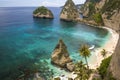 Beautiful aerial view of tropical paradise beach and rock cliff with amazing turquoise sea water and palm trees in Summer holidays Royalty Free Stock Photo