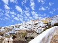 Beautiful aerial view of white washed villas against blue sky, Santorini, Greece Royalty Free Stock Photo