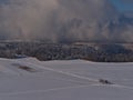 Aerial view of winter landscape with people doing cross-country skiing on snow-covered fields viewed from KornbÃÂ¼hl hill. Royalty Free Stock Photo