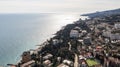 Beautiful aerial view of the Yalta bay in Crimea. Aerial view of Yalta embankment from drone, old Lighthouse on pier, sea coast la Royalty Free Stock Photo