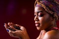 beautiful africa-american woman with turban ower the head in studio