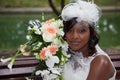 Beautiful african american bride posing in her wedding day with bouquet Royalty Free Stock Photo