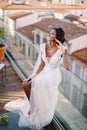 Beautiful African American bride in a white wedding dress, touches her face in vintage gloves. Fine-Art Wedding in Royalty Free Stock Photo