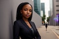 Beautiful african american in business suit on background of metropolitan. Elegant black woman in classic style in