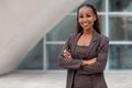 Beautiful african american business woman portrait, arms folded, confident happy CEO Royalty Free Stock Photo