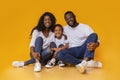 Beautiful african american family sitting on floor and smiling Royalty Free Stock Photo