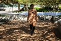 African american  female fashion model with an Afro is walking in a park Royalty Free Stock Photo