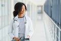 Beautiful african american female pediatric nurse in modern office Royalty Free Stock Photo