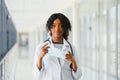 Beautiful african american female pediatric nurse in modern office