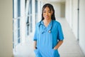 Beautiful african american female pediatric nurse in modern office Royalty Free Stock Photo