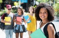 Beautiful african american female student with group of international students