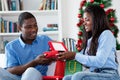 Beautiful african american love couple with gifts and christmas presents Royalty Free Stock Photo