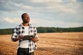 Beautiful African American man is in the agricultural field Royalty Free Stock Photo