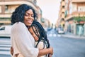 Beautiful african american mother and daughter smiling happy and hugging Royalty Free Stock Photo