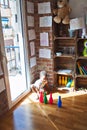 Beautiful african american toddler taking skittles to play bowling at kindergarten