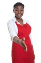 Beautiful african american waitress reaching hand for handshake Royalty Free Stock Photo