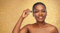 Beautiful african american woman applying mascara Royalty Free Stock Photo