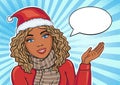 Beautiful african american woman in Christmas Santa costume smiling and showing on speech bubble, pop art style