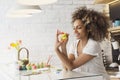 Beautiful African American woman coloring eggs Royalty Free Stock Photo