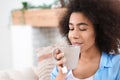 Beautiful African-American woman drinking tea at home Royalty Free Stock Photo