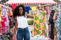 Beautiful african american woman selling clothes at market Royalty Free Stock Photo