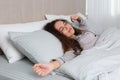 Beautiful African American woman stretching in bed at home Royalty Free Stock Photo