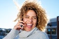 Beautiful african american woman talking on mobile phone and laughing Royalty Free Stock Photo