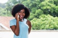 Beautiful african american woman talking at phone Royalty Free Stock Photo