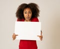 Attractive african american woman with blank board happy and surprised showing and selling product Royalty Free Stock Photo